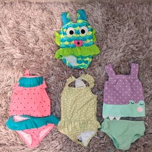 Four baby swimsuits, size 6 months. Worn once each. Fast shipping!